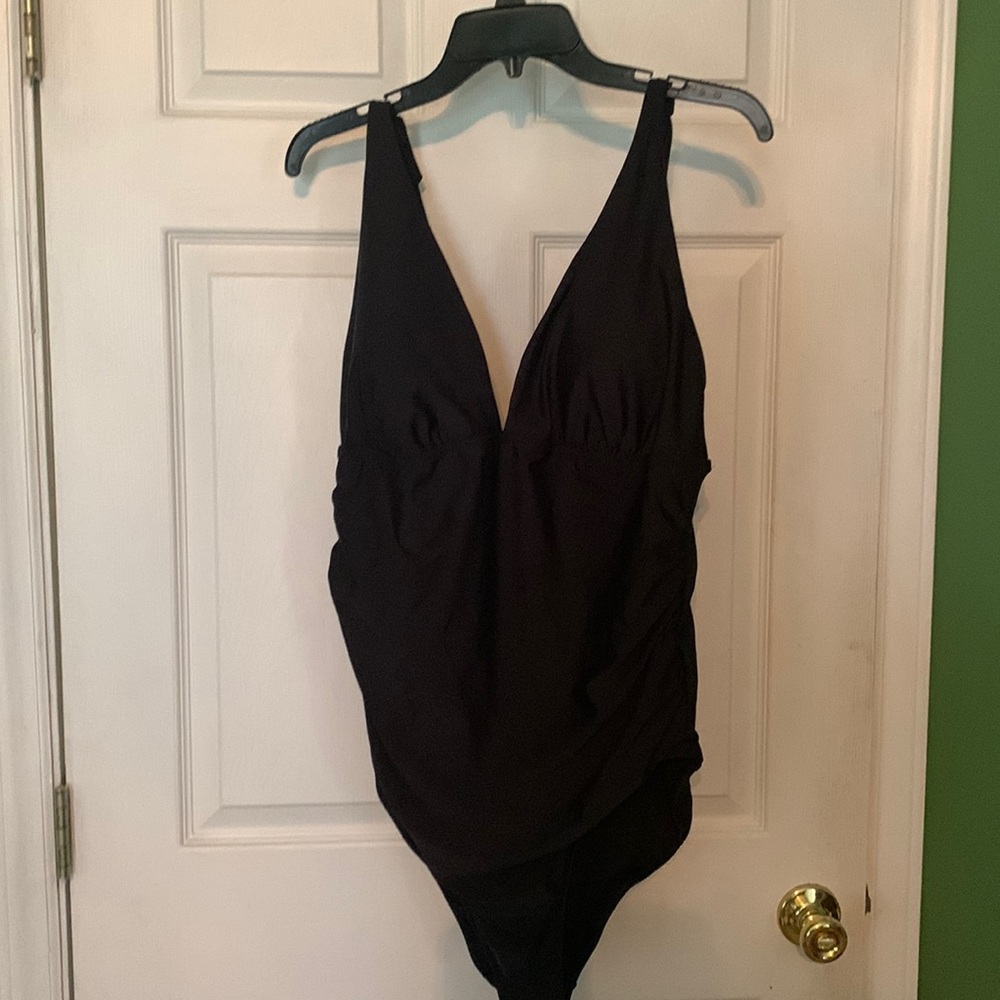 One piece black with cute bow details on straps